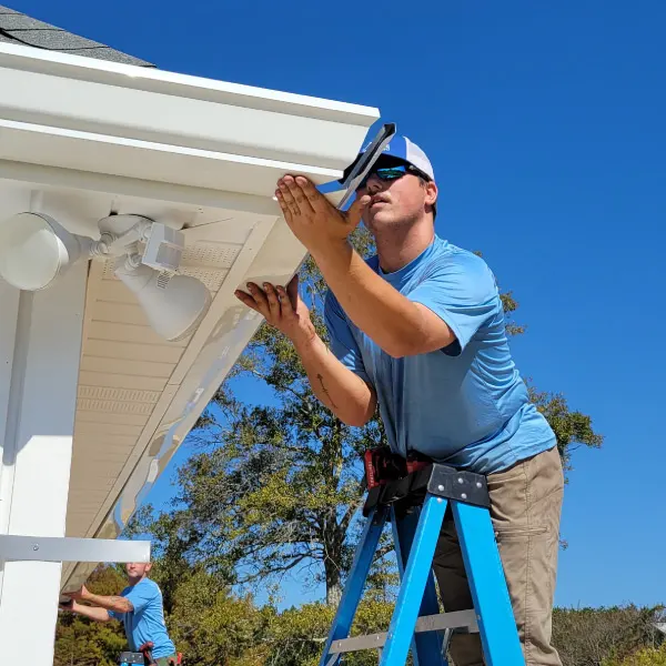 Faithful Gutters installing seamless gutter outside corner
